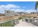 Spacious backyard with a well-maintained lawn, wooden fence, patio, and outdoor seating area at 12405 E 101St Dr, Commerce City, CO 80022