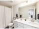 Well-lit bathroom with a double vanity, modern fixtures, and a clean, contemporary design at 12405 E 101St Dr, Commerce City, CO 80022