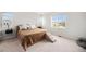 Bright bedroom with a large window and neutral décor at 12405 E 101St Dr, Commerce City, CO 80022