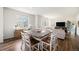 Open dining area with ample natural light and views of the living room at 12405 E 101St Dr, Commerce City, CO 80022