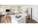 Modern kitchen and open concept eat-in area and living room at 12405 E 101St Dr, Commerce City, CO 80022