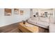 Cozy living room showcasing hardwood floors and modern artwork at 12405 E 101St Dr, Commerce City, CO 80022