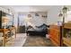 Bedroom with modern flooring, neutral walls, and natural light at 3320 S Ammons St # 104, Lakewood, CO 80227