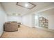 Spacious finished basement featuring carpeting, recessed lighting, and shelving at 1063 W Powers Ave, Littleton, CO 80120