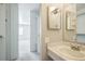 Bathroom adjacent to the walk-in closet features a single sink and vanity at 1063 W Powers Ave, Littleton, CO 80120