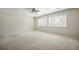 Spacious bedroom features a ceiling fan and large windows for natural light at 1063 W Powers Ave, Littleton, CO 80120