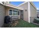 Inviting front porch with a planter and secure door, ideal for outdoor enjoyment at 1063 W Powers Ave, Littleton, CO 80120