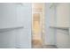 Walk-in closet offers abundant storage with built-in shelving and rod space at 1063 W Powers Ave, Littleton, CO 80120