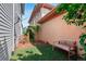 A backyard with artificial turf, bench, and garden at 6735 Avrum Dr, Denver, CO 80221