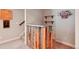 Close-up of the basement bar, featuring wood paneling and shelving at 6735 Avrum Dr, Denver, CO 80221