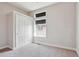 This bedroom features a large closet, neutral carpet, natural lighting, and a modern feel at 6735 Avrum Dr, Denver, CO 80221