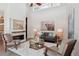Bright living room featuring vaulted ceilings, a fireplace, and stylish decor at 6735 Avrum Dr, Denver, CO 80221