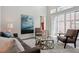 Cozy living room with a plush rug, comfortable seating, and sliding glass doors at 6735 Avrum Dr, Denver, CO 80221