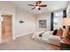 The primary bedroom boasts abundant space, plush carpet, natural light, and a convenient en suite bathroom at 6735 Avrum Dr, Denver, CO 80221