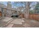 Exterior view of backyard with patio area and wooden fence at 235 S Monaco Pkwy, Denver, CO 80224