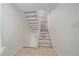 Entryway featuring a carpeted staircase and tile flooring at 235 S Monaco Pkwy, Denver, CO 80224