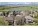 Stunning aerial view of a beautiful community with a pond and golf course in the background at 3002 S Oak Way, Lakewood, CO 80227