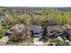 Beautiful home with mature trees, a manicured lawn, and a two-car garage in a lush neighborhood at 3002 S Oak Way, Lakewood, CO 80227