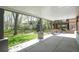 Covered back patio with manicured lawn and backyard views at 3002 S Oak Way, Lakewood, CO 80227