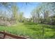 Idyllic backyard with mature trees and lush greenery at 3002 S Oak Way, Lakewood, CO 80227
