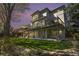 Exterior of home at sunset featuring a backyard with a patio and deck perfect for entertaining at 3002 S Oak Way, Lakewood, CO 80227