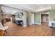 Spacious finished basement with wood floors and open layout; features plenty of room to entertain and relax at 3002 S Oak Way, Lakewood, CO 80227
