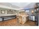 Basement bar with wooden countertop, shelving, and a beer tap, perfect for enjoying beverages and entertaining at 3002 S Oak Way, Lakewood, CO 80227