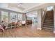 Finished basement with wood floors, play area with natural light, and staircase access at 3002 S Oak Way, Lakewood, CO 80227