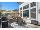 Back deck featuring ample seating, a grill, and an umbrella for shade at 3002 S Oak Way, Lakewood, CO 80227