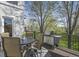 Outdoor deck features dining table, grill, and views of the backyard at 3002 S Oak Way, Lakewood, CO 80227