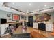 Office featuring sports decor, custom cabinets, an expansive desk, and hardwood floors at 3002 S Oak Way, Lakewood, CO 80227