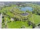 An overhead view featuring a community park with a lake, trails, and recreational areas at 411 S Cody Ct, Lakewood, CO 80226