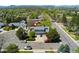 A beautiful aerial view of the property showing the surrounding neighborhood and landscaping at 411 S Cody Ct, Lakewood, CO 80226