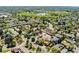 An overhead view showcasing the home, its surrounding greenery, and neighborhood layout at 411 S Cody Ct, Lakewood, CO 80226