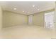 Spacious finished basement featuring carpet flooring, recessed lighting, and a bathroom at 411 S Cody Ct, Lakewood, CO 80226