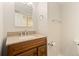 Bathroom featuring granite countertops, stylish vanity and a large mirror at 411 S Cody Ct, Lakewood, CO 80226