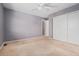 Bedroom with neutral carpet and white closet doors at 411 S Cody Ct, Lakewood, CO 80226