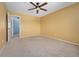 Spacious bedroom featuring neutral walls, carpeting and a ceiling fan at 411 S Cody Ct, Lakewood, CO 80226