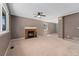 Spacious living room with a cozy fireplace and ample natural light at 411 S Cody Ct, Lakewood, CO 80226