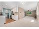 Inviting open-concept space seamlessly connects the living room, dining area, and kitchen at 411 S Cody Ct, Lakewood, CO 80226