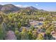 Overhead shot capturing homes surrounded by foliage, set against a mountainous landscape at 350 Arapahoe Ave # 17, Boulder, CO 80302