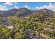 Aerial view of a community surrounded by lush trees and mountains at 350 Arapahoe Ave # 17, Boulder, CO 80302