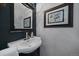 Charming bathroom features a stylish sink, framed mirror, and an elegant piece of art at 350 Arapahoe Ave # 17, Boulder, CO 80302