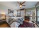 Comfortable bedroom featuring a ceiling fan, two large windows, and a cozy rug at 350 Arapahoe Ave # 17, Boulder, CO 80302