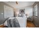 Cozy bedroom with two side lamps, a large print, and a window providing natural light at 350 Arapahoe Ave # 17, Boulder, CO 80302