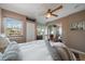 Bright bedroom with a window, ceiling fan, and a view into an adjacent room at 350 Arapahoe Ave # 17, Boulder, CO 80302