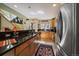 Well-lit kitchen with stainless steel appliances, hardwood floors, and natural light at 350 Arapahoe Ave # 17, Boulder, CO 80302