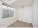 Finished basement area with a large window for natural light and closets for storage space at 18899 E Whitaker Cir, Aurora, CO 80015
