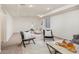 Finished basement area featuring neutral walls, cozy carpeting, and a comfortable seating arrangement at 18899 E Whitaker Cir, Aurora, CO 80015