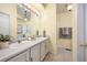 Bathroom features double sinks, tile floors and a large mirror at 18899 E Whitaker Cir, Aurora, CO 80015
